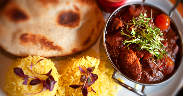 Indian meal with rice, curry and naan bread 